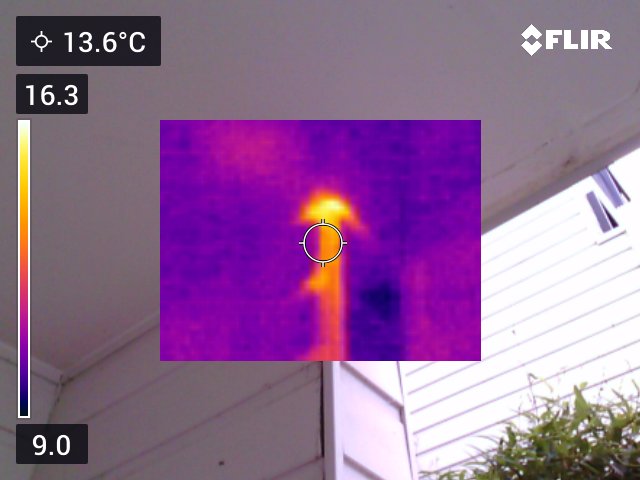 Thermal imaging camera pinpointing a hidden leak behind a wall
